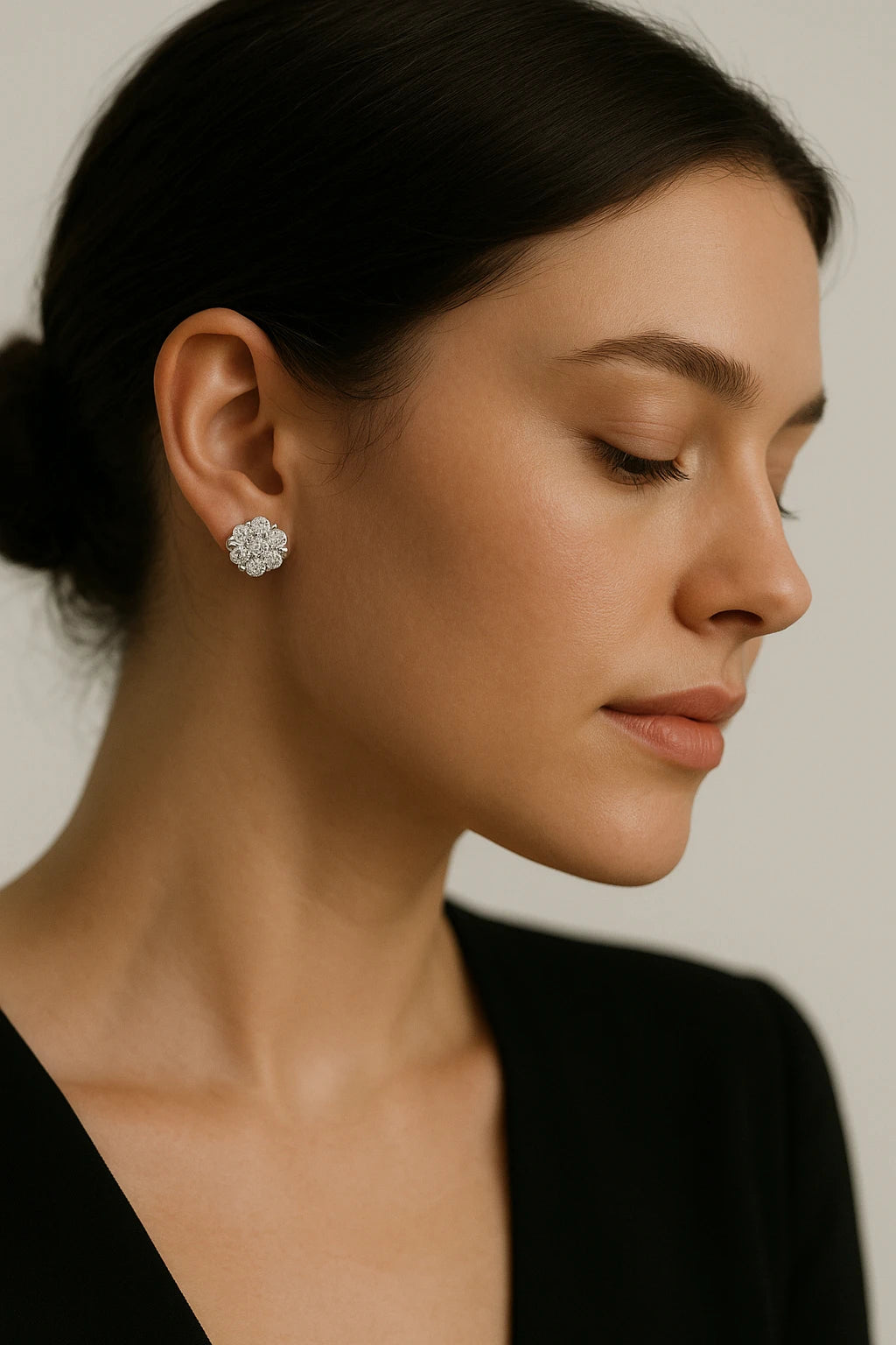 A pair of 14K white gold diamond flower earrings with a total weight of 1.00 carat.